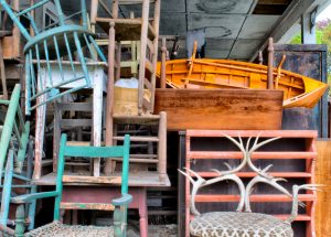 unwanted furniture stacked inside a garage