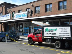 Flannery's helping with commercial junk removal services at a building