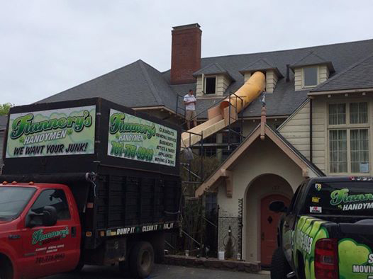 Flannery's junk removal truck helping a home with trash removal