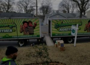 Flannery's moving trucks outside a home that has been sold