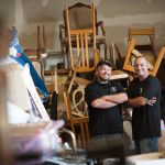 Todd and Rory Flannery inside a messy home