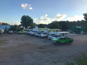 The moving trucks and dumpsters at Flannery's Handymen