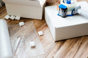 wrapping glass items in bubble wrap for a move