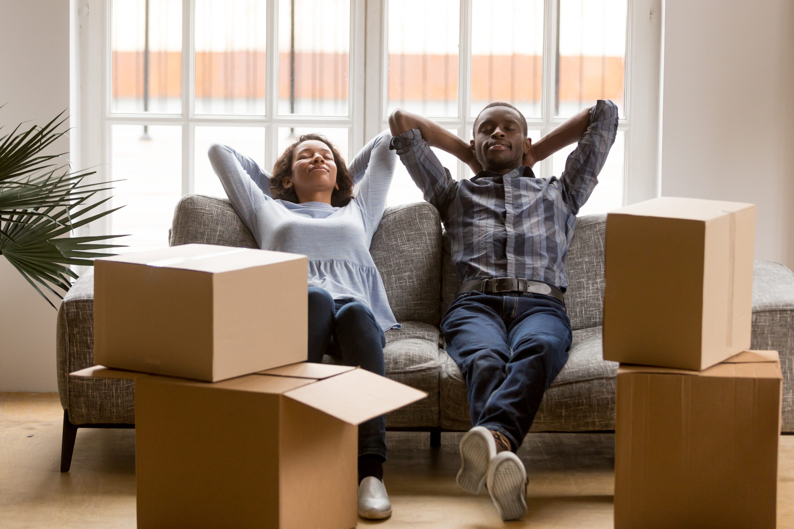 stress-free moving with movers relaxed on the couch